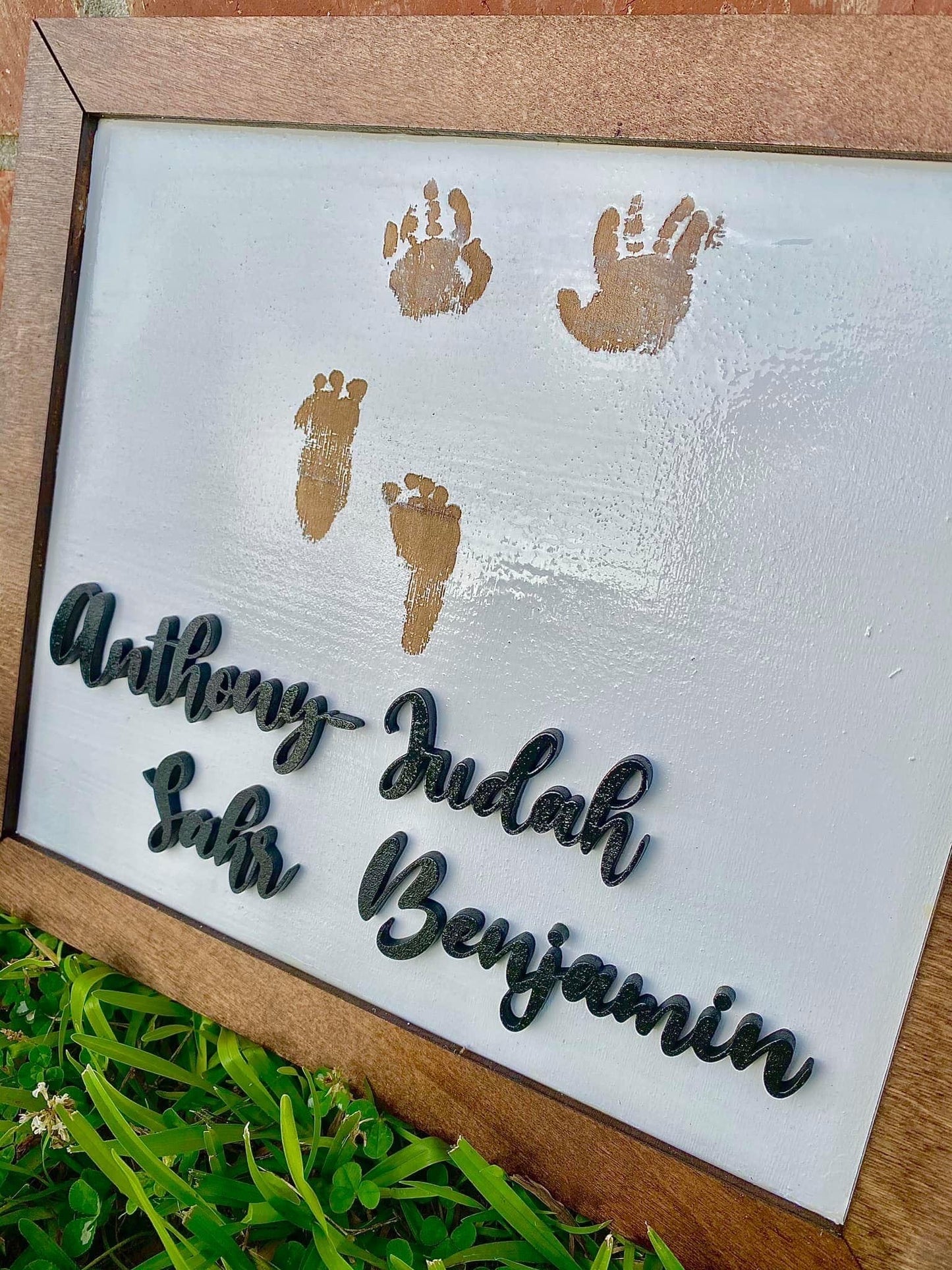 Hands and feet memorial plaque